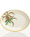 A mixture of Lenox's Holiday holly motif and their classic Christmas plaid ribbon creates an elegant design upon this wide oval serving platter from the holiday dinnerware and dishes collection. Scrolling accents and a rim of 24-karat gold finish the look with lasting grace.