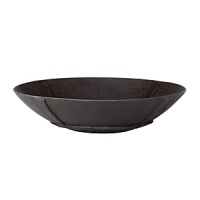 Handcrafted in India, this low profile, matte black metal bowl combines a primitive rustic look with all the benefits of modern design. Functioning elegantly as a decorative piece, it can also be used to feature certain foods. Handcrafted in India, this low profile, matte black metal bowl combines a primitive rustic look with all the benefits of modern design. Functioning elegantly as a decorative piece, it can also be used to feature certain foods.