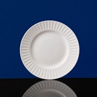 Simple shapes of crisp white are accented with precisely etched lines. Contrasting black matte jasper accessories with glazed interiors are also available. Bone china. Simple shapes of crisp white are accented with precisely etched lines. Contrasting black matte jasper accessories with glazed interiors are also available. Bone china.