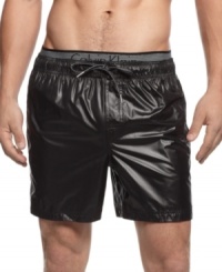 Shine on. Be a standout style star when you're playing in the sun and sand in these swim trunks from Calvin Klein. Shine on. Be a standout style star when you're playing in the sun and sand in these swim trunks from Calvin Klein.