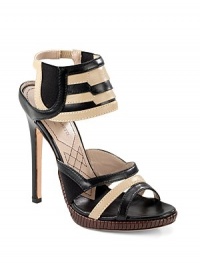 Contrasting shades of calf leather add striking drama to this ankle wrap design with braided details at the platform.Stacked heel, 4½ (115mm) Braided leather covered platform, ¼ (5mm) Compares to a 4¼ heel (110mm) Open toe Elastic inserts at tiered ankle wrap 68% rayon/32% silk Leather lining and sole Made in Italy Contrasting shades of calf leather add striking drama to this ankle wrap design with braided details at the platform.Stacked heel, 4½ (115mm) Braided leather covered platform, ¼ (5mm) Compares to a 4¼ heel (110mm) Open toe Elastic inserts at tiered ankle wrap 68% rayon/32% silk Leather lining and sole Made in Italy