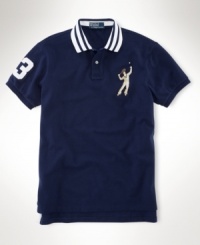 Crafted in breathable cotton mesh, a trim-fitting polo shirt exudes timeless, athletic style with a vintage-inspired embroidered tennis player at the chest. Crafted in breathable cotton mesh, a trim-fitting polo shirt exudes timeless, athletic style with a vintage-inspired embroidered tennis player at the chest.