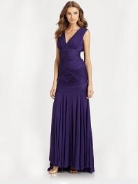 Signature Halston glamour, expressed in a vibrant floor-length design tailored with ruched basketweave details.Surplice necklineSleevelessRuched waistbandBasketweave constructionFlared skirtConcealed side zipFully linedAbout 46 from natural waistAcetate/nylonDry cleanImportedModel shown is 5'10 (177cm) wearing US size Small. Signature Halston glamour, expressed in a vibrant floor-length design tailored with ruched basketweave details.Surplice necklineSleevelessRuched waistbandBasketweave constructionFlared skirtConcealed side zipFully linedAbout 46 from natural waistAcetate/nylonDry cleanImportedModel shown is 5'10 (177cm) wearing US size Small.