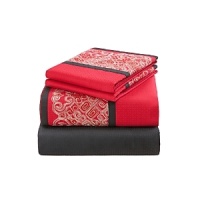 Josie Natori once again brings Eastern art to Western life with Geisha. A profusion of Geisha Red contrasting against Natori Black evokes a feeling of rich mystery. The his and her Geisha and Samurai Euros feature hints of pearly shoulders and necks, contrasted with jet-black chignons and red kimono accents. Embroidery on the Euros is of fine silky yarn on a dramatically contrasting ground of Khaki cotton. Further evoking Eastern art in the form of a samurai sword, the obi quilting pattern uses golden threads on the Geisha Red coverlet which creates a modern geometric texture with an embroidered border. Josie Natori once again brings Eastern art to Western life with Geisha. A profusion of Geisha Red contrasting against Natori Black evokes a feeling of rich mystery. The his and her Geisha and Samurai Euros feature hints of pearly shoulders and necks, contrasted with jet-black chignons and red kimono accents. Embroidery on the Euros is of fine silky yarn on a dramatically contrasting ground of Khaki cotton. Further evoking Eastern art in the form of a samurai sword, the obi quilting pattern uses golden threads on the Geisha Red coverlet which creates a modern geometric texture with an embroidered border.