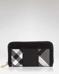 Keep your cash (and card) cache organized with Burberry's black and white check wallet. Take the plaid package into after hours-- it doubles as a preppy chic clutch with a bright sheath and kitten heels. Keep your cash (and card) cache organized with Burberry's black and white check wallet. Take the plaid package into after hours-- it doubles as a preppy chic clutch with a bright sheath and kitten heels.