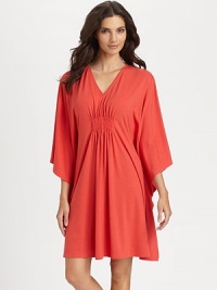 Wide sleeves and center ruching make for a flattering silhouette of soft-stretch fabric. V-neckThree-quarter length wide dolman sleevesCenter ruching for added drapeAbout 36 from shoulder to hem62% polyester/33% rayon/5% spandexMachine washImported Wide sleeves and center ruching make for a flattering silhouette of soft-stretch fabric. V-neckThree-quarter length wide dolman sleevesCenter ruching for added drapeAbout 36 from shoulder to hem62% polyester/33% rayon/5% spandexMachine washImported