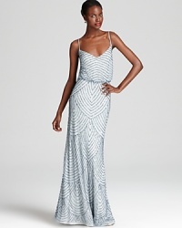 Intricate beading takes form in a scalloped pattern on Adrianna Papell's standout blouson gown. Intricate beading takes form in a scalloped pattern on Adrianna Papell's standout blouson gown.