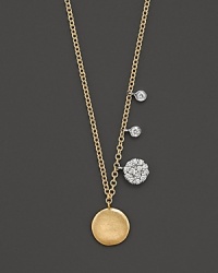 Diamond charms and golden discs sparkle and jingle on a 14K yellow gold chain. Diamond charms and golden discs sparkle and jingle on a 14K yellow gold chain.