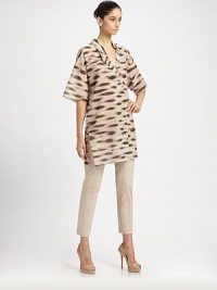 Chic tunic style blouse in cotton voile with an abstract animal print.V necklineCrossover lapelsDropped shoulderWide elbow-length sleevesConcealed button front closureVented sidesAbout 35 from shoulder to hemCottonDry cleanImported of Italian fabricModel shown is 5'11 (180cm) wearing US size 4.OUR FIT MODEL RECOMMENDS ordering true size. Chic tunic style blouse in cotton voile with an abstract animal print.V necklineCrossover lapelsDropped shoulderWide elbow-length sleevesConcealed button front closureVented sidesAbout 35 from shoulder to hemCottonDry cleanImported of Italian fabricModel shown is 5'11 (180cm) wearing US size 4.OUR FIT MODEL RECOMMENDS ordering true size.