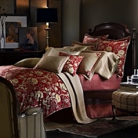 A classic chinoiserie pattern pairs with heritage motifs - fretwork, stripes and florals - in a bold, modern color palette to create a unique bedding ensemble.