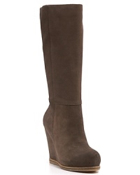 Basic yet bold, these sculpted wedge boots move from the office to after hours in luxuriously soft suede. By Lucky Brand. Basic yet bold, these sculpted wedge boots move from the office to after hours in luxuriously soft suede. By Lucky Brand.