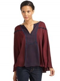 THE LOOKSplit neckColorblock design with contrast pipingPoncho-inspired styleLong kimono sleevesTHE FITAbout 29 from shoulder to hemTHE MATERIALPolyesterCARE & ORIGINDry cleanImportedModel shown is 5'9 (175cm) wearing US size X-Small/Small. THE LOOKSplit neckColorblock design with contrast pipingPoncho-inspired styleLong kimono sleevesTHE FITAbout 29 from shoulder to hemTHE MATERIALPolyesterCARE & ORIGINDry cleanImportedModel shown is 5'9 (175cm) wearing US size X-Small/Small.