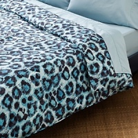 This printed cheetah spot ventures into the wild to turn your personal habitat into an exotic escape. In hues of blue, black and white, its unconventional tonality creates a bold focal point. This printed cheetah spot ventures into the wild to turn your personal habitat into an exotic escape. In hues of blue, black and white, its unconventional tonality creates a bold focal point.