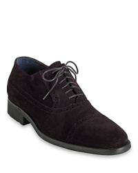Classic refinement meets modern design with this handsome suede oxford from Cole Haan, furnished with Nike Air technology for exceptional comfort all day and all night. Classic refinement meets modern design with this handsome suede oxford from Cole Haan, furnished with Nike Air technology for exceptional comfort all day and all night.