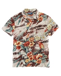 A preppy island print lends bold tropical appeal to a classic-fitting short-sleeved polo shirt in fluid cotton jersey. A preppy island print lends bold tropical appeal to a classic-fitting short-sleeved polo shirt in fluid cotton jersey.