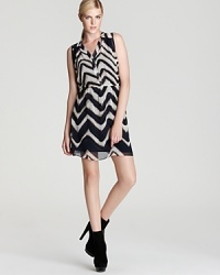 Aqua's graphic zig zag print dress is modern in its design and versatility; this seasonless favorite layers effortlessly for year-round wear. Aqua's graphic zig zag print dress is modern in its design and versatility; this seasonless favorite layers effortlessly for year-round wear.