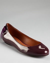 A corset-inspired, grosgrain laceup lends a feminine finish to Vera Wang Lavender Label's Helen flats. A corset-inspired, grosgrain laceup lends a feminine finish to Vera Wang Lavender Label's Helen flats.
