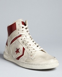 A retro-cool high top from Converse by John Varvatos, fully distressed for an authentic look on and off the court. A retro-cool high top from Converse by John Varvatos, fully distressed for an authentic look on and off the court.