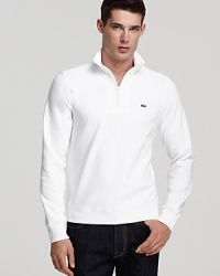 Perfect for layering on a windy afternoon, or when the sun goes down at the shore, this Lacoste sweatshirt adds an athletic touch to your laid-back wardrobe. Perfect for layering on a windy afternoon, or when the sun goes down at the shore, this Lacoste sweatshirt adds an athletic touch to your laid-back wardrobe.