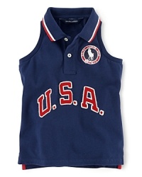 A red, white and blue design finished with U.S.A. patching and embroidered emblems gives a preppy all-American look to the classic sleeveless polo, celebrating Team USA's participation in the 2012 Olympics. A red, white and blue design finished with U.S.A. patching and embroidered emblems gives a preppy all-American look to the classic sleeveless polo, celebrating Team USA's participation in the 2012 Olympics.
