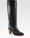 Build a chic ensemble with soft stitch-detailed knee boots in smooth, lustrous leather. Stacked heel, 3 (75mm)Shaft, 15Leg circumference, 15Leather upperPull-on styleLeather lining and solePadded insoleMade in ItalyOUR FIT MODEL RECOMMENDS ordering one size up as this style runs small. 