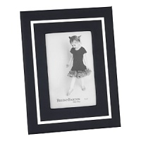 This modern design draws the eye with a silver bezel accent, then steps aside so you can admire your favorite photo without distraction. Featuring a black leather cover for a luxurious touch. This modern design draws the eye with a silver bezel accent, then steps aside so you can admire your favorite photo without distraction. Featuring a black leather cover for a luxurious touch.