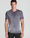 One side has the appearance of velvet, and the other offers a solid alternative. A flexible, masculine henley from John Varvatos USA.