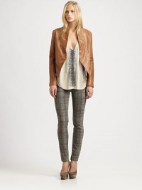 Join the downtown crowd in this collarless leather jacket with an asymmetrical, cropped-back hem and strategically placed zippers. CollarlessLong sleeves with zippered cuffsFront snap closuresZippered slash pocketsAsymmetrical, cropped-back hemZipper at back hemLeatherDry clean with leather specialistImportedModel shown is 5'10 (177cm) wearing US size Small.This style runs true to size. We recommend ordering your usual size for a standard fit. Join the downtown crowd in this collarless leather jacket with an asymmetrical, cropped-back hem and strategically placed zippers. CollarlessLong sleeves with zippered cuffsFront snap closuresZippered slash pocketsAsymmetrical, cropped-back hemZipper at back hemLeatherDry clean with leather specialistImportedModel shown is 5'10 (177cm) wearing US size Small.This style runs true to size. We recommend ordering your usual size for a standard fit.