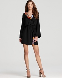 Abloom with vibrant floral embroidery at the neckline and belt, this Trina Turk dress adds tropical flavor to your every day. Bold-hued sandals add an extra pop of color for a vivid finish. Abloom with vibrant floral embroidery at the neckline and belt, this Trina Turk dress adds tropical flavor to your every day. Bold-hued sandals add an extra pop of color for a vivid finish.