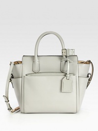 An elegant zip-top tote designed to balance function and luxury with soft geometry.Double top handles, 4½ dropDetachable adjustable shoulder strap, 21½-23 dropTop zip closureThree outside open pocketsOne detachable zip pouchOne inside zip pocketTwo inside open pockets9½W X 10H X 5DImported An elegant zip-top tote designed to balance function and luxury with soft geometry.Double top handles, 4½ dropDetachable adjustable shoulder strap, 21½-23 dropTop zip closureThree outside open pocketsOne detachable zip pouchOne inside zip pocketTwo inside open pockets9½W X 10H X 5DImported
