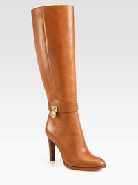 Signature goldtone hardware gleams against this buttery leather boot with a towering stacked heel. Stacked heel, 3¾ (95mm)Leather upperSide zipLeather lining and solePadded insoleImported Signature goldtone hardware gleams against this buttery leather boot with a towering stacked heel. Stacked heel, 3¾ (95mm)Leather upperSide zipLeather lining and solePadded insoleImported