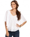 This elegant petite top from DKNY Jeans' will keep you stylishly comfortable in the heat! The lightweight voile fabric and butterfly sleeves give it an ethereal quality.