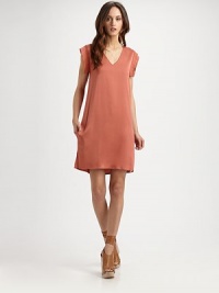 Silk v-neck with open cap sleeves, slash pockets and side slits at the hem. V-neckOpen cap sleevesSide slits at hemAbout 20 from natural waist95% silk/5% spandexDry cleanImportedModel shown is 5'11 (180cm) wearing US size 4. Silk v-neck with open cap sleeves, slash pockets and side slits at the hem. V-neckOpen cap sleevesSide slits at hemAbout 20 from natural waist95% silk/5% spandexDry cleanImportedModel shown is 5'11 (180cm) wearing US size 4.