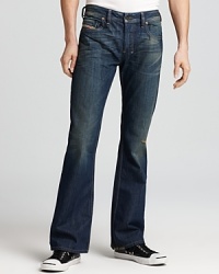 Every guy needs a pair of everyday jeans he can count on. Worn-in with fading detail, these Diesel jeans fit the bill, with a classic, regular fit for the ultimate in comfort and style. Every guy needs a pair of everyday jeans he can count on. Worn-in with fading detail, these Diesel jeans fit the bill, with a classic, regular fit for the ultimate in comfort and style.
