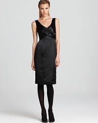 Create a stir at cocktails in this Armani Collezioni v neck dress, flaunting a chic bow at the waistline for a subtle touch of femininity. Create a stir at cocktails in this Armani Collezioni v neck dress, flaunting a chic bow at the waistline for a subtle touch of femininity.
