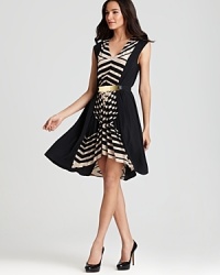 Bold stripes take on a flattering formation on this pleated Akiko dress rendered in luxe silk.