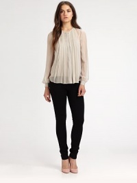 Ultra-flattering pleats adorn the front of this semi-sheer, silky must-have.Round necklineLong sleevesFront buttonHi-lo hemAbout 26 from shoulder to hemSilkDry cleanImportedModel shown is 5'10 (177cm) wearing US size 4. Ultra-flattering pleats adorn the front of this semi-sheer, silky must-have.Round necklineLong sleevesFront buttonHi-lo hemAbout 26 from shoulder to hemSilkDry cleanImportedModel shown is 5'10 (177cm) wearing US size 4.