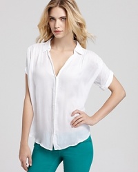 A versatile go-with-all, this sheer Aqua button-down top pairs with color denim for cool-girl weekend style. A versatile go-with-all, this sheer Aqua button-down top pairs with color denim for cool-girl weekend style.