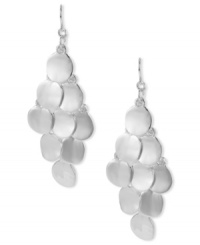 Shimmering circles create an elegant silhouette on these Kenneth Cole New York chandelier earrings. Crafted in silver tone mixed metal. Approximate drop: 2-3/4 inches. Shimmering circles create an elegant silhouette on these Kenneth Cole New York chandelier earrings. Crafted in silver tone mixed metal. Approximate drop: 2-3/4 inches.