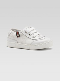 The famous fabric in a subtle GG jacquard, trimmed with rich leather and a striped, webbed flag accent at the edge.GG fabric upperLeather toe, tongue and back accentsThree-grommet lace-up frontG button detailRubber soleMade in Italy The famous fabric in a subtle GG jacquard, trimmed with rich leather and a striped, webbed flag accent at the edge.GG fabric upperLeather toe, tongue and back accentsThree-grommet lace-up frontG button detailRubber soleMade in Italy