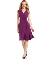 Ruching at the waist and a flared skirt are just two of a few flirty features on this petite Evan Picone dress, crafted of a swingy jersey fabric. Ruching at the waist and a flared skirt are just two of a few flirty features on this petite Evan Picone dress, crafted of a swingy jersey fabric.
