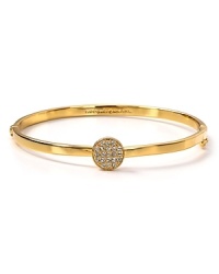 Hit the bright spot with this kate spade new york bangle, cast in gold plate with a striking crystal stone station. Hit the bright spot with this kate spade new york bangle, cast in gold plate with a striking crystal stone station.