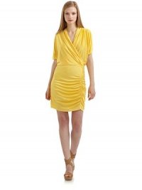 THE LOOKSurplice V-neckCinched dolman sleevesFront drapingShirring along sidesPullover styleTHE FITAbout 39 from shoulder to hemTHE MATERIAL95% nylon/5% spandexFully linedCARE & ORIGINHand washMade in USAModel shown is 5'10½ (179cm) wearing US size Small. THE LOOKSurplice V-neckCinched dolman sleevesFront drapingShirring along sidesPullover styleTHE FITAbout 39 from shoulder to hemTHE MATERIAL95% nylon/5% spandexFully linedCARE & ORIGINHand washMade in USAModel shown is 5'10½ (179cm) wearing US size Small.