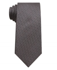 With a natty throwback pattern, this houndstooth skinny tie from Bar III is instantly dapper. With a natty throwback pattern, this houndstooth skinny tie from Bar III is instantly dapper.