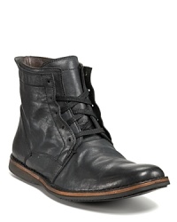 A beautifully beat up boot from John Varvatos Star USA. The Barret has partially concealed lace up closure, a pull tab at the back and a contrast stripe along the welt. A beautifully beat up boot from John Varvatos Star USA. The Barret has partially concealed lace up closure, a pull tab at the back and a contrast stripe along the welt.