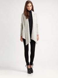 Rich cables, luxuriously done in a sumptuous blend of wool and cashmere from Italy with a tantalizing draped front.Draped shawl collarOpen front with pointed extended hemKilt pin fastener includedLong sleeves with ribbed cuffsSewn hemAbout 31 from shoulder to hemWool/cashmereDry cleanMade in ItalySIZE & FITModel shown is 5'10 (177cm) wearing US size Small. Rich cables, luxuriously done in a sumptuous blend of wool and cashmere from Italy with a tantalizing draped front.Draped shawl collarOpen front with pointed extended hemKilt pin fastener includedLong sleeves with ribbed cuffsSewn hemAbout 31 from shoulder to hemWool/cashmereDry cleanMade in ItalySIZE & FITModel shown is 5'10 (177cm) wearing US size Small.