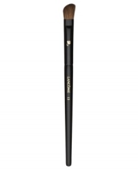 This angled, natural-bristled brush is the ideal partner to all eye shadows. Its slightly rounded edges perfectly apply shadow to the crease and corners of the eye. Brush hairs are slightly more narrow for controlled application. How to use: Dip the angled side of the brush into the shadow and tap off excess. For crease contouring press the angled side horizontally into the crease with the longer end toward the outside of the eye. For a bolder effect press vertically into the crease with the longer end downward. For corner contouring sweep the angled side downward from the outermost area of the crease, toward the lashes, finishing above the iris. This angled, natural-bristled brush is the ideal partner to all eye shadows. Its slightly rounded edges perfectly apply shadow to the crease and corners of the eye. Brush hairs are slightly more narrow for controlled application. How to use: Dip the angled side of the brush into the shadow and tap off excess. For crease contouring press the angled side horizontally into the crease with the longer end toward the outside of the eye. For a bolder effect press vertically into the crease with the longer end downward. For corner contouring sweep the angled side downward from the outermost area of the crease, toward the lashes, finishing above the iris.