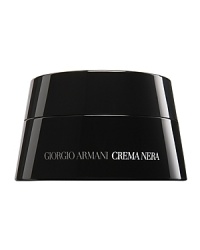 Giorgio Armani premiers Crema Nera-a unique cell-regenerating cream inspired by the Italian island of Pantelleria. Containing a unique formulation of obsidian, a natural mineral compound extracted from the petrified lava on Pantelleria, Crema Nera perfectly captures the Earth's rejuvenating secrets. This exceptional, patented formula is scientifically proven to actively restore and revitalize skin's natural radiance and regenerate surface cells. The immaculate white cream helps to uncover your skin's beauty, life and youth.Enclosed in a black lacquer box, this luxury jar includes a black obsidian massage stone. From the time of Ancient Greece and Rome, obsidian was believed to have kinetic energy which, when placed at certain conjunctures of the body, would rejuvenate. The obsidian massage stone was created with this intent and should be used with each application of Crema Nera.