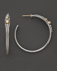 Graceful and lithe, these sterling silver hoops are accented with 18K yellow gold and pearls, recalling the beauty of ancient design. By Konstantino.