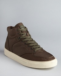 Sport these hip tonal sneakers from Diesel for a go-anywhere style that expresses your casual cool vibe. Sport these hip tonal sneakers from Diesel for a go-anywhere style that expresses your casual cool vibe.